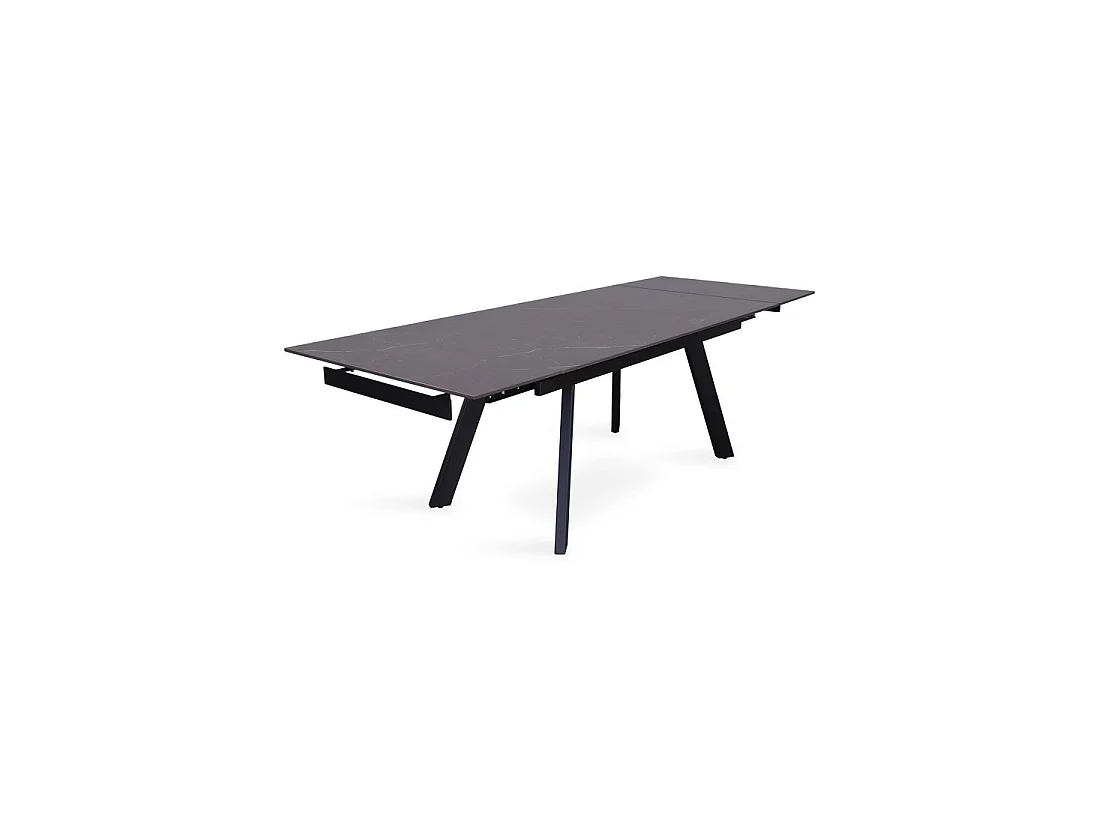 Table à manger extensible pour 10 personnes avec plateau en pierre noire collection LAROS. Structure en métal.