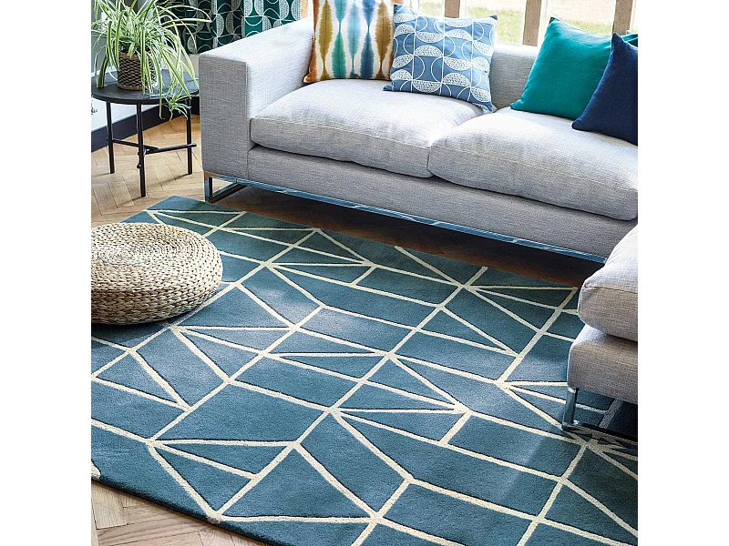 tapis salle de jeux 160x230 fait à la main en laine bleu rectangle motif abstrait