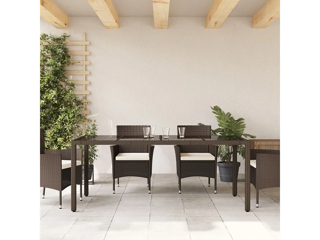 Michiel  Table de jardin avec dessus en verre marron résine tressée