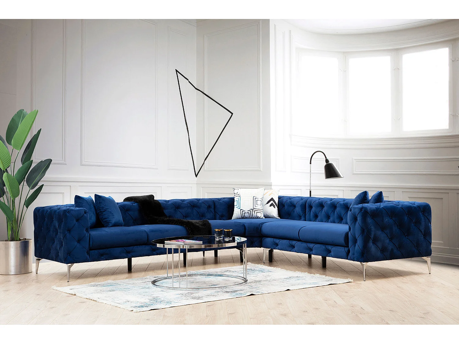 Canapé d'angle gauche capitonné velours bleu marine et pieds chromés Herakles 270cm