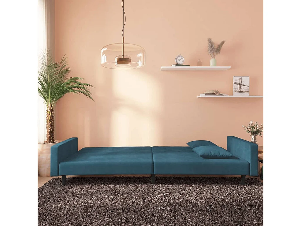 Canapé-lit à 2 places avec deux oreillers bleu velours