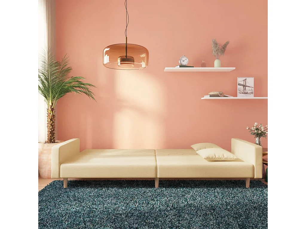 Canapé-lit à 2 places avec deux oreillers crème tissu