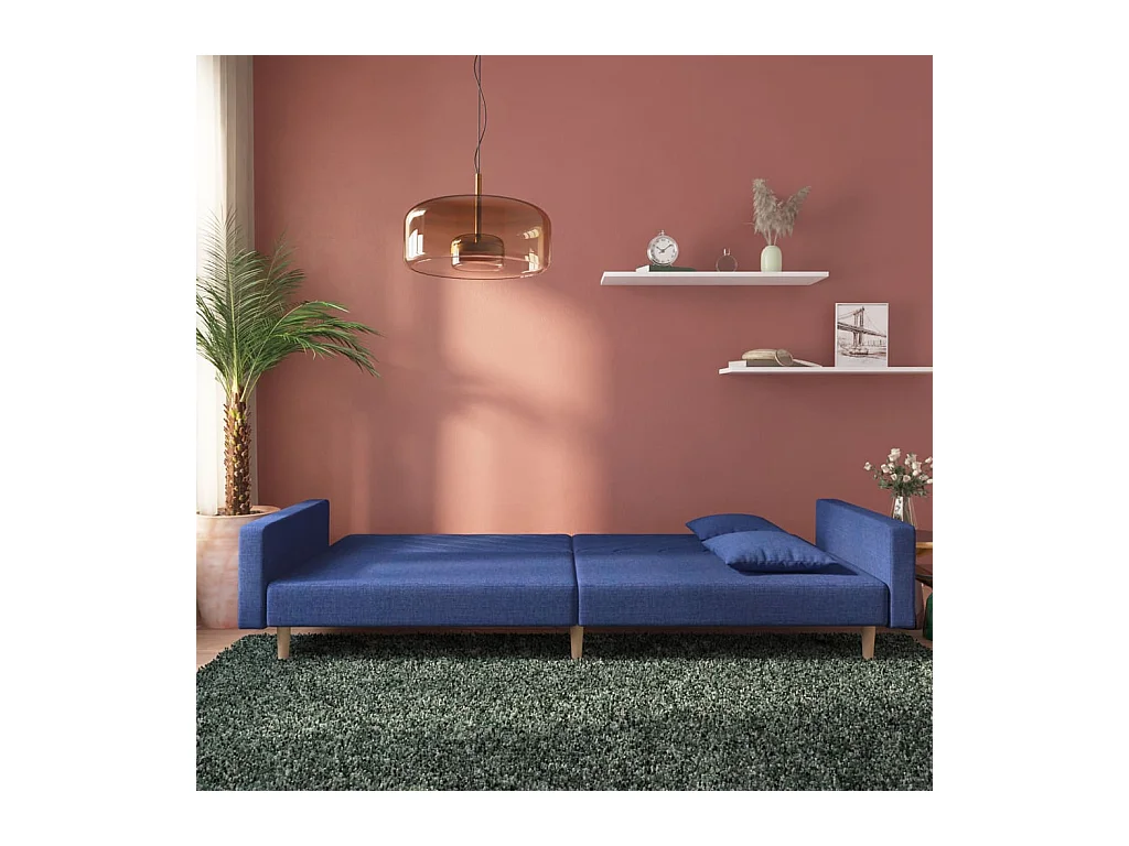 Canapé-lit à 2 places avec deux oreillers bleu tissu