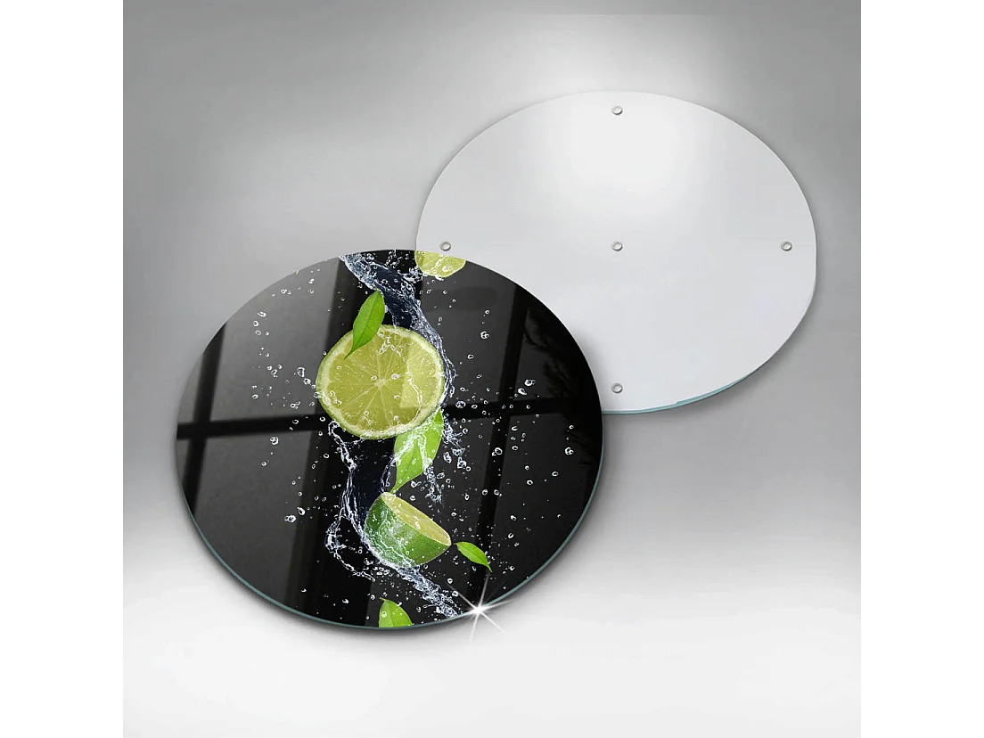 Planche de cuisine ronde en verre, 30 cm Citrons verts juteux dans l'eau