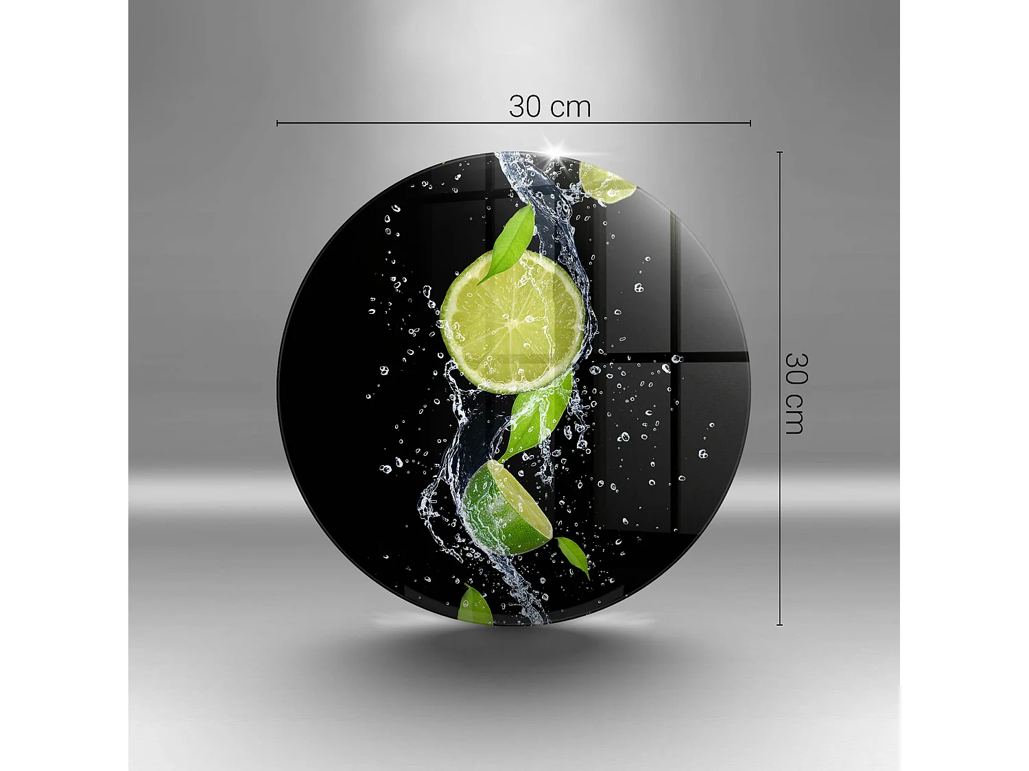 Planche de cuisine ronde en verre, 30 cm Citrons verts juteux dans l'eau