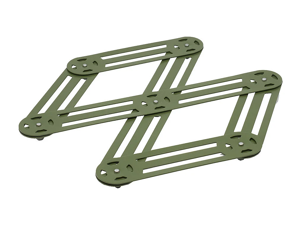 Le dessous de plat étirable en cuivre 25x12 cm de chez Roger Orfevre allie éléga