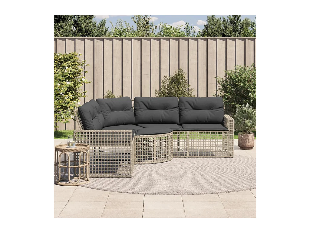 Divano da giardino a forma di L in rattan, cuscini e poggiapiedi