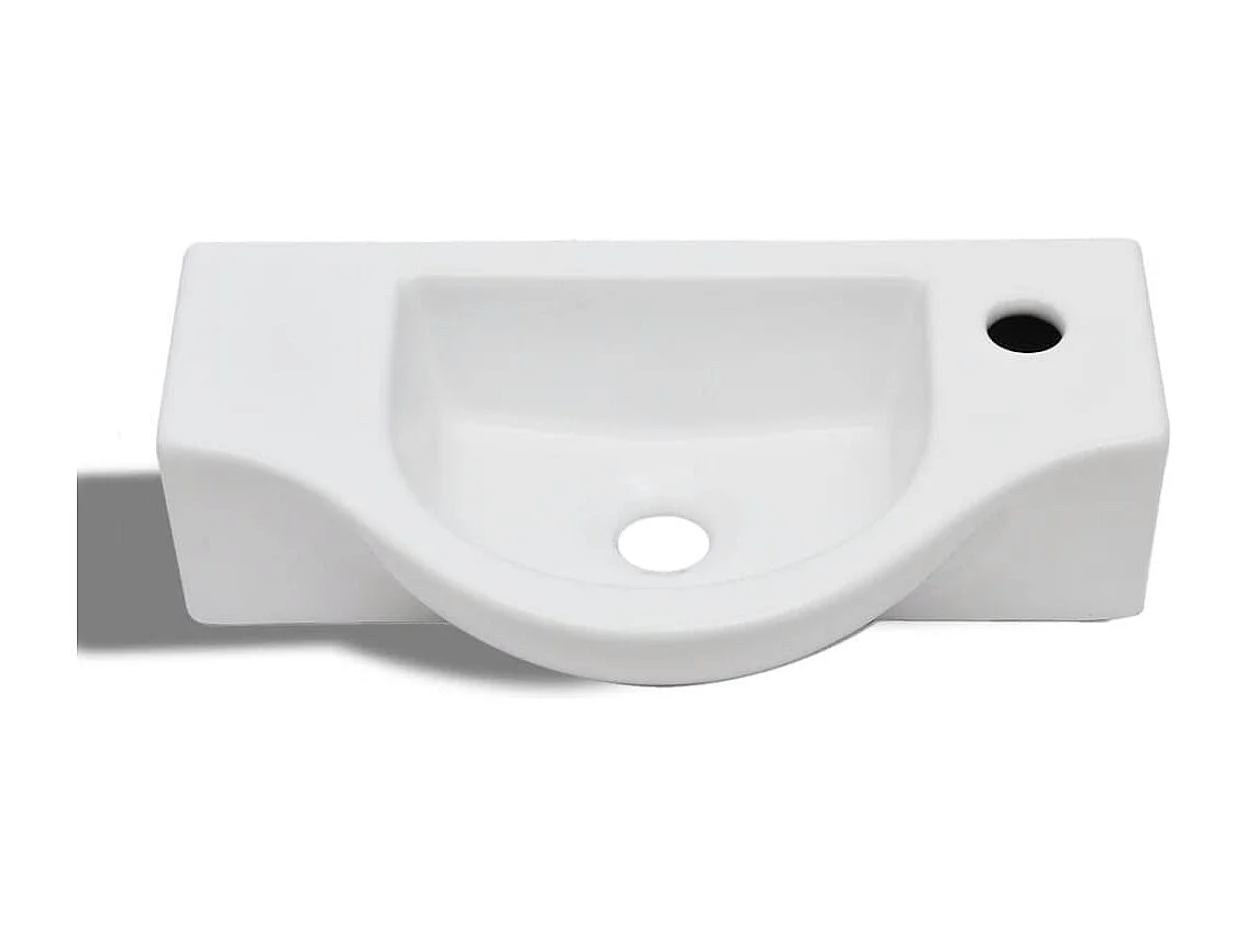 Lavabo con orificio para grifo de cerámica blanca para baño.