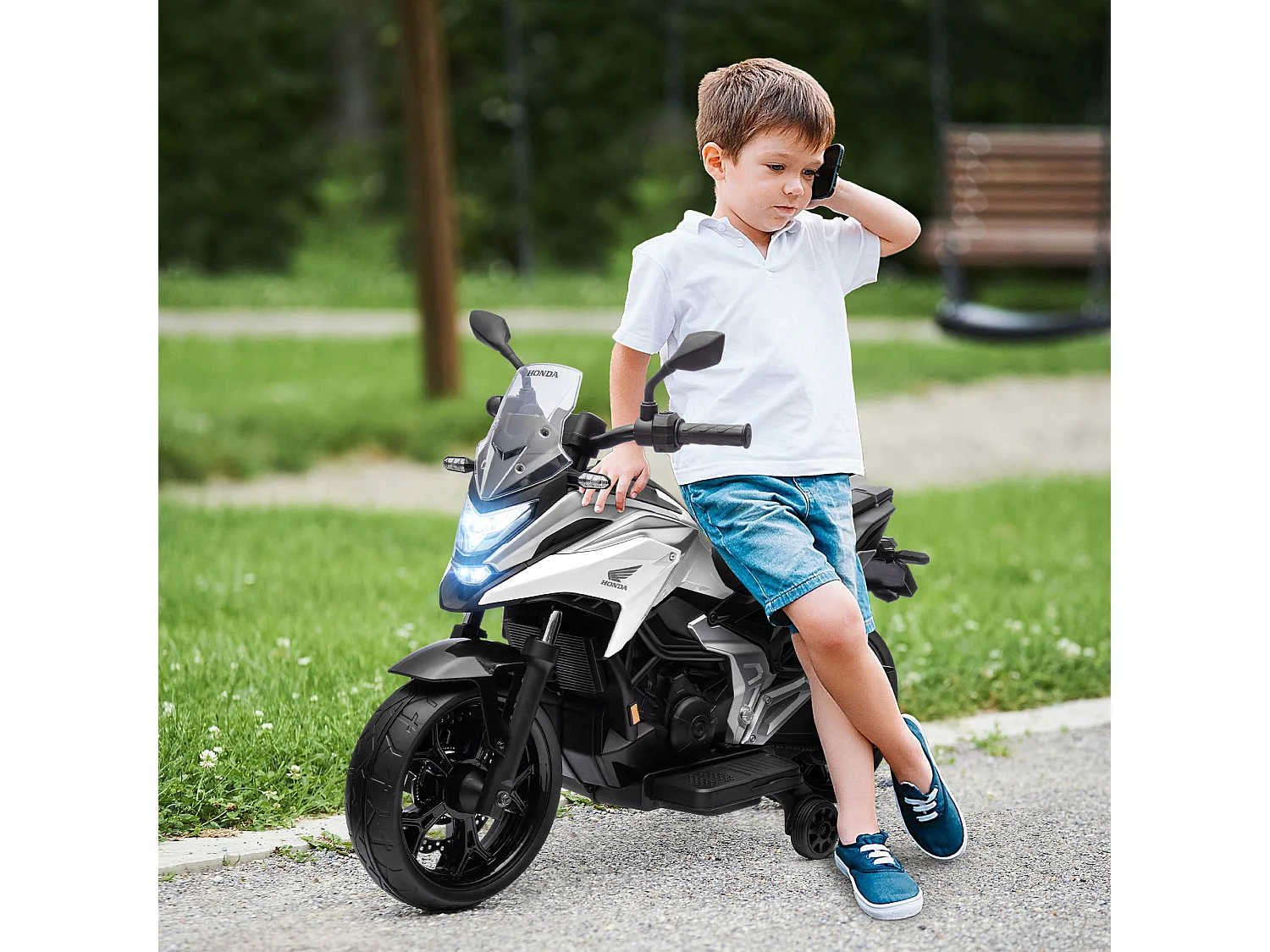 Moto électrique enfant Honda NC750x - musiques, feux AV LED, entrée USB MP3 jack - 2 roues support aux. - blanc