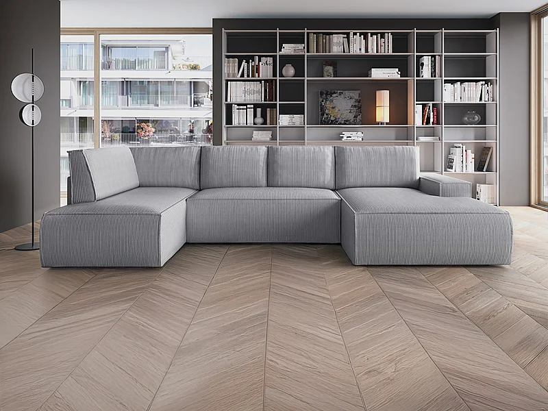 Stor panorama hjørnesofa med chaiselong til højre, der kan omdannes til seng, i lysegråt fløjlsstof AMELIA