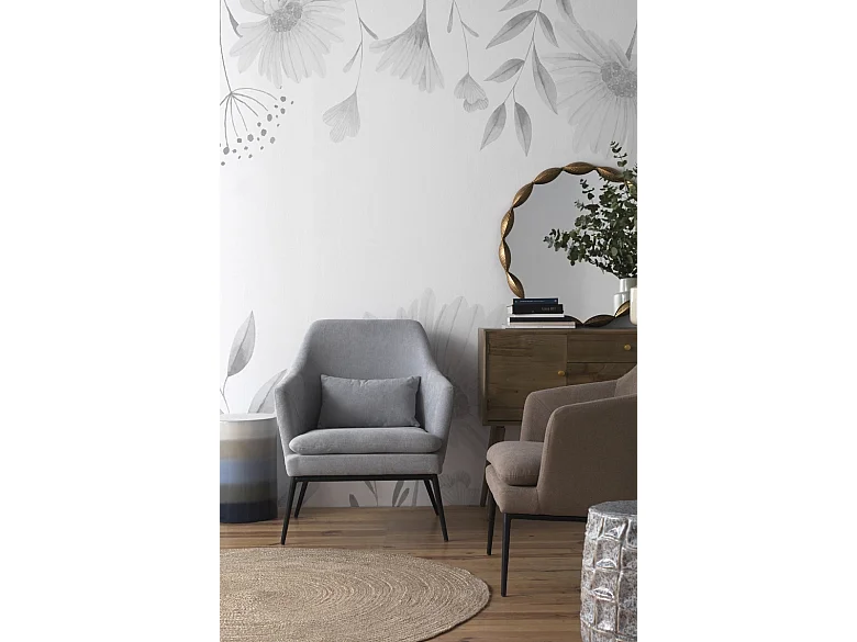 Fauteuil tapissé gris perle avec coussin et pieds en métal noir