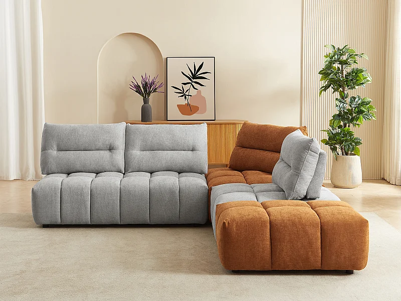 Grand canapé d'angle modulable dossier avance-recule en tissu texturé gris clair et terracotta APOLIU