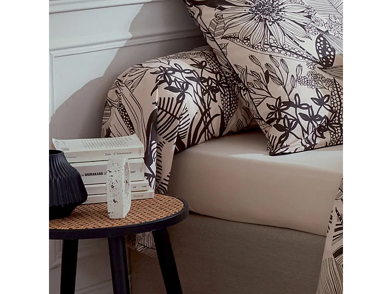 Almohada cilíndrica con estampados negros