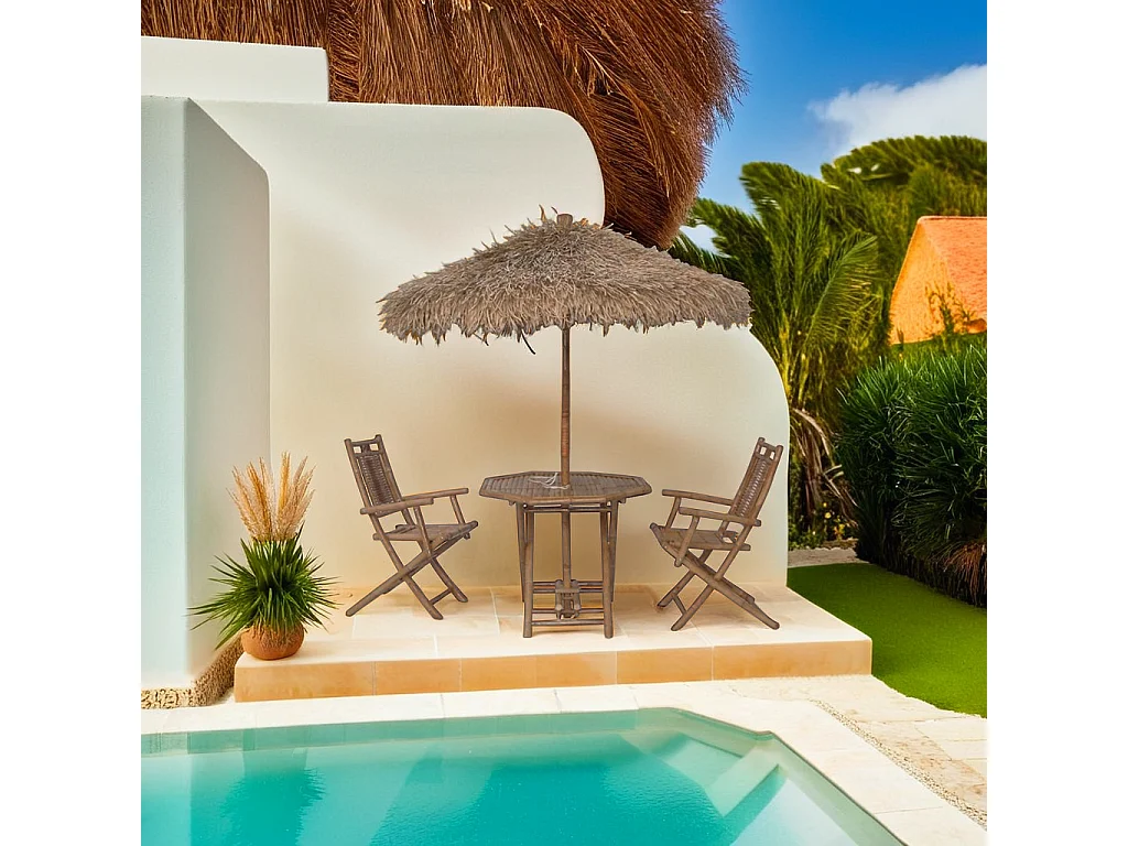 Tavolo con ombrellone e sedie in bambù