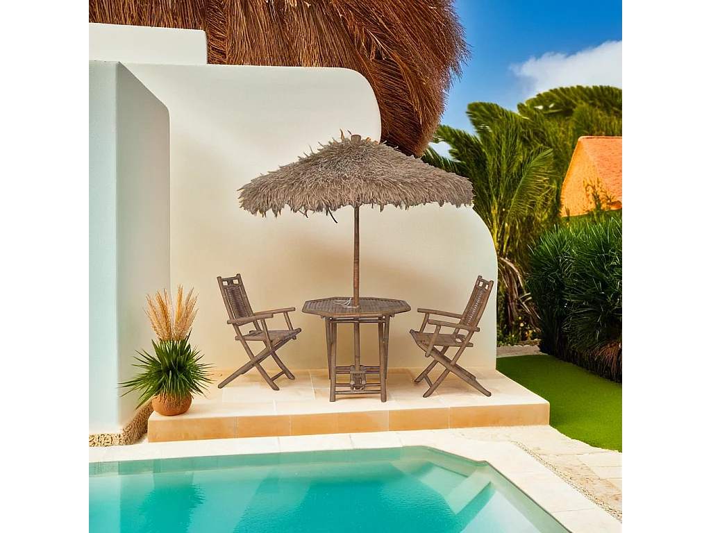 Tavolo con ombrellone e sedie in bambù