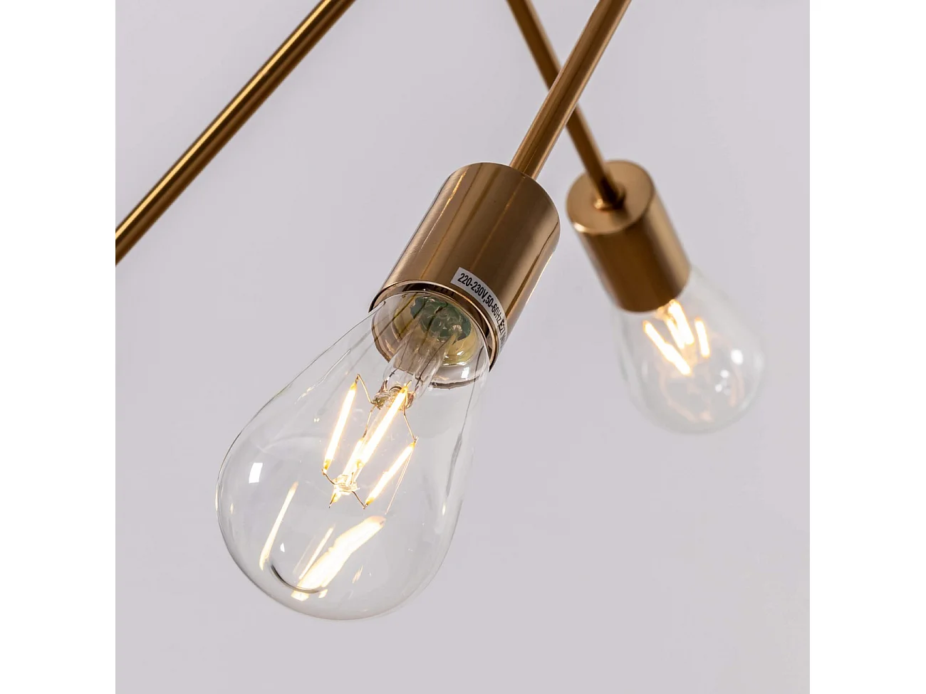 Suspension au fini laiton quatre tiges métalliques - Sagitta