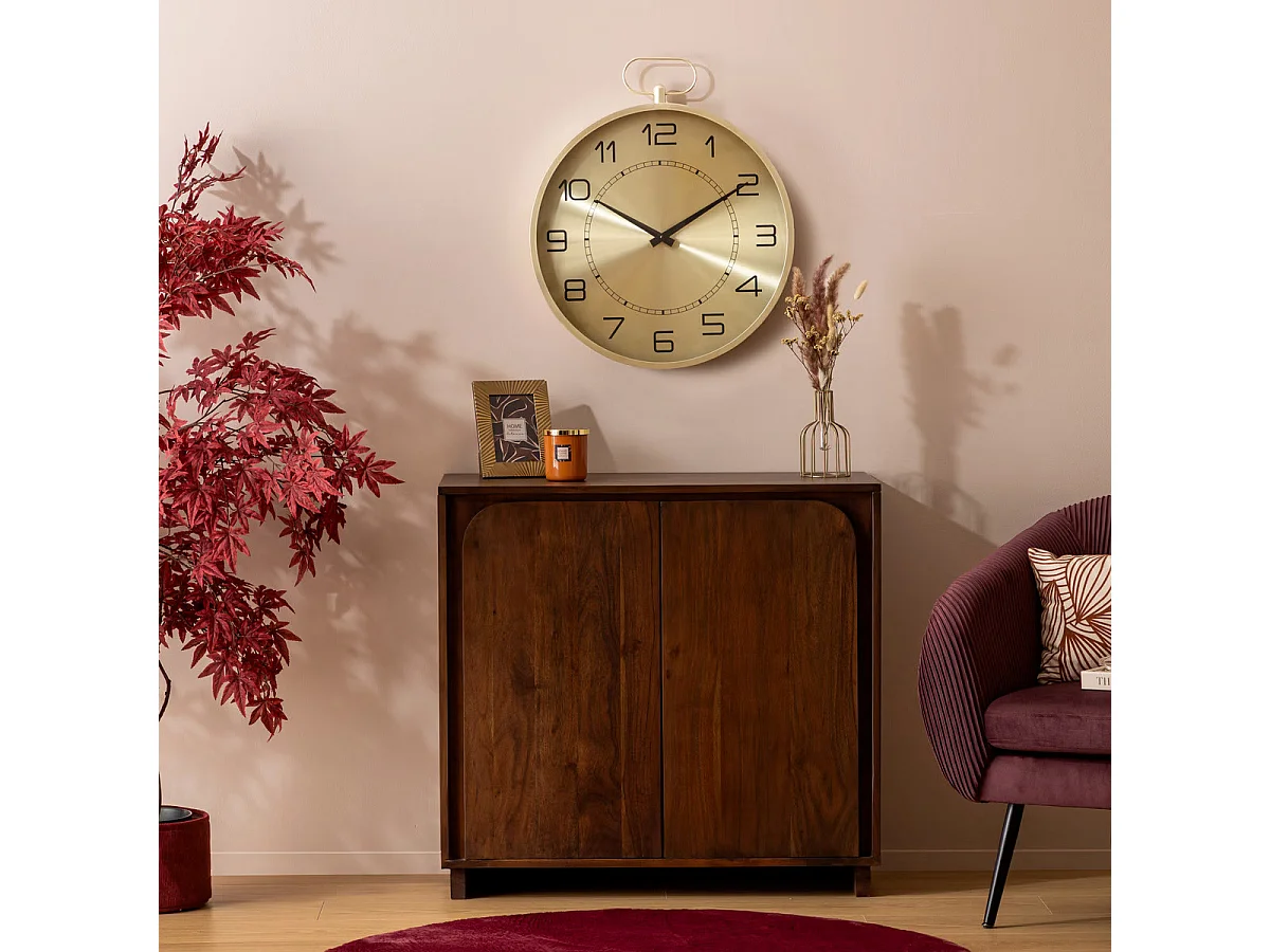 Pendule murele forme Gousset en Métal doré D 53 cm