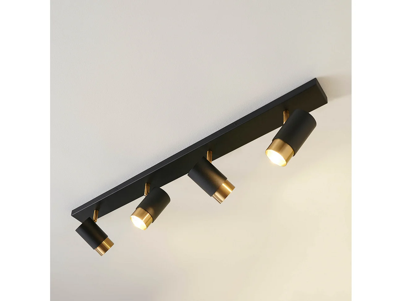 Plafonnier moderne 4 projecteurs orientables noirs et dorés - Pozzo