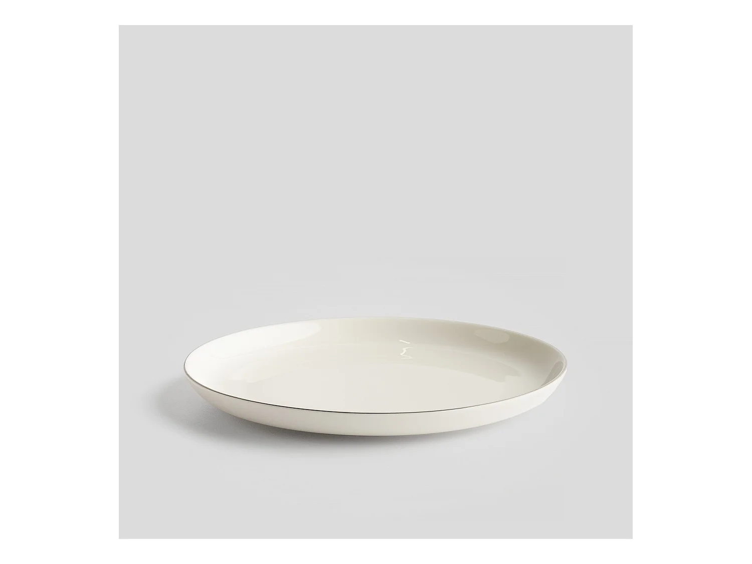 Eleganter Porzellan Dessertteller mit Silberrand