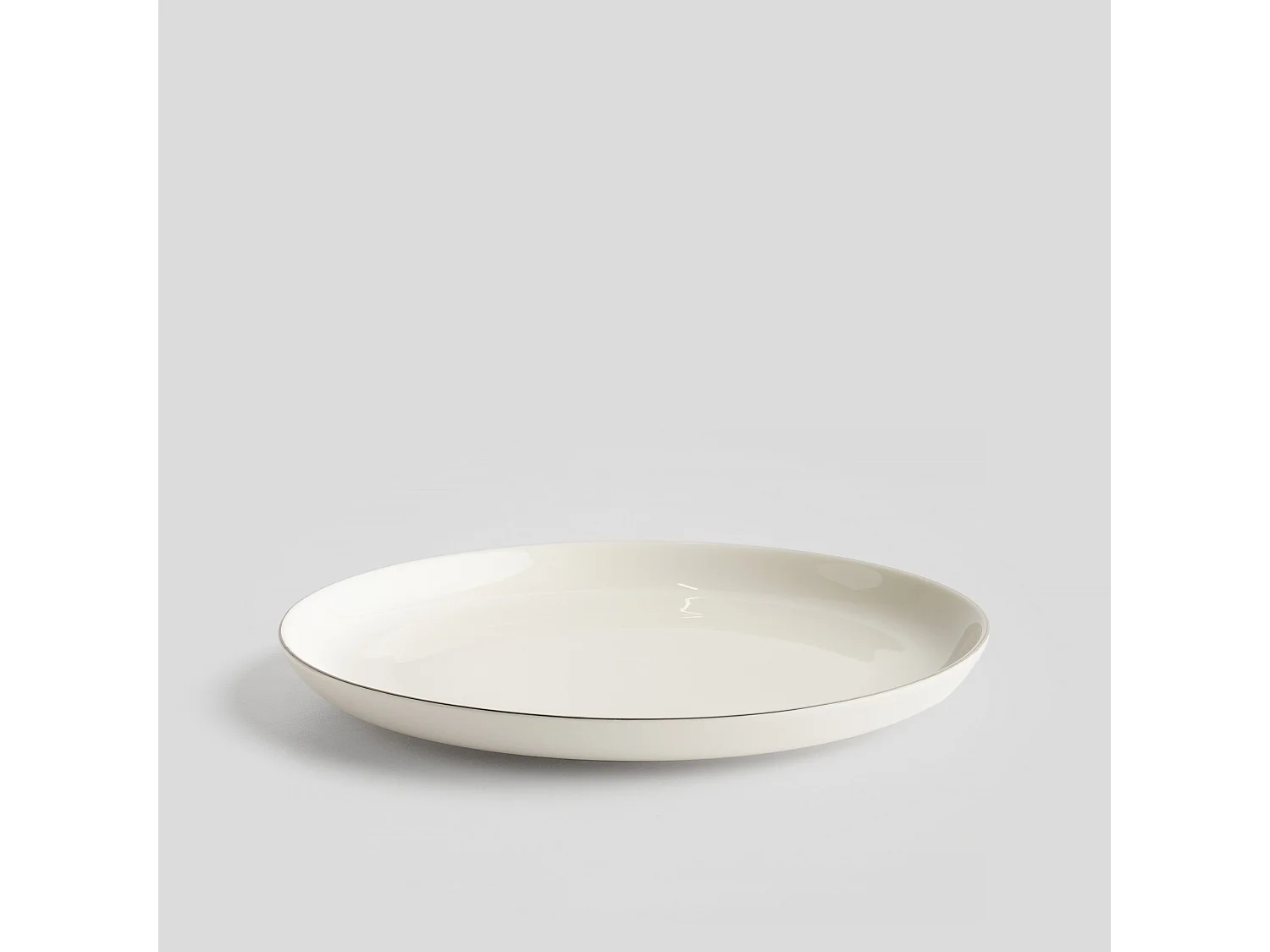 Eleganter Porzellan Dessertteller mit Silberrand