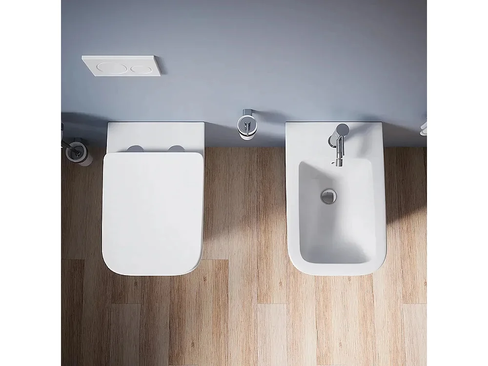 Sanitari bagno Bidet e Vaso WC a terra filomuro RIMLESS in ceramica con sedile coprivaso softclose CUBE