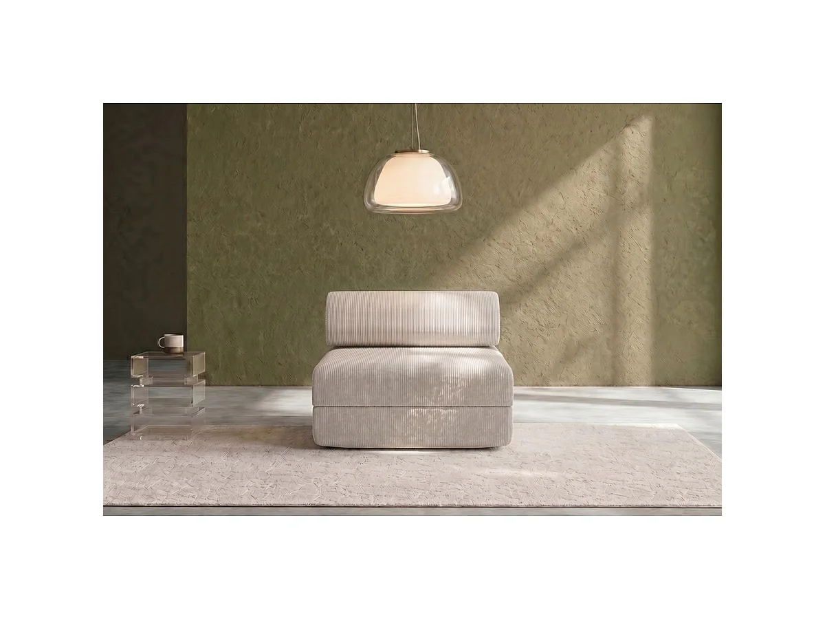 Witte corduroy fauteuil die omgebouwd kan worden tot fauteuil