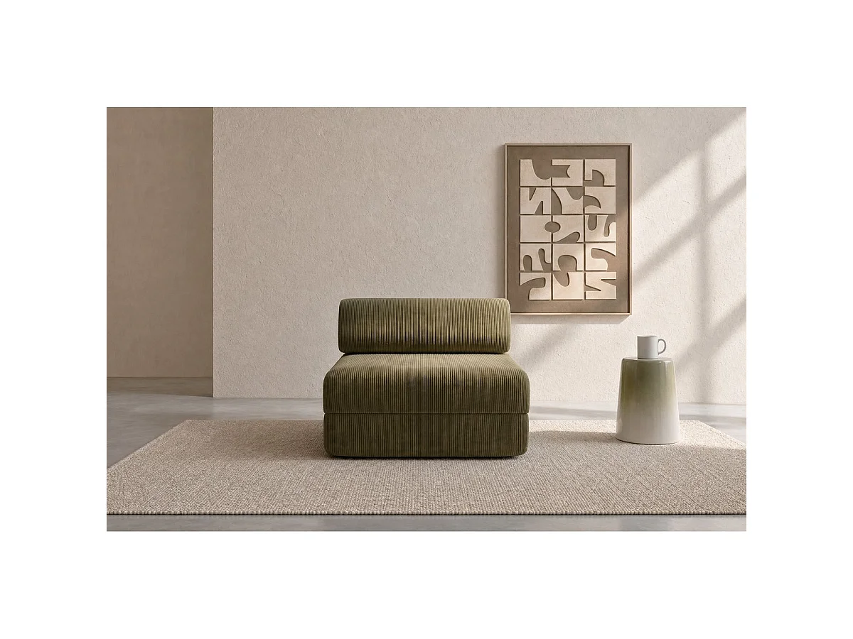 Groene corduroy fauteuil, geschikt om mee te ontspannen