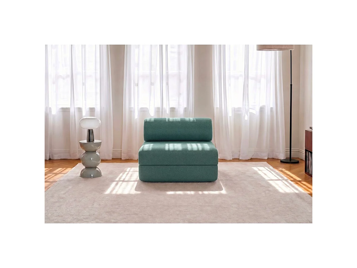 Omvormbare fauteuil in gladde groene stof
