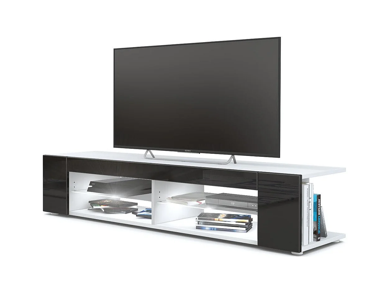 Buffet bas Movie, Meuble TV avec 4 compartiments ouverts et placages décoratifs, Blanc mat/Noir brillant, éclairage LED blanc inclus (134 x 29 x 39 cm)