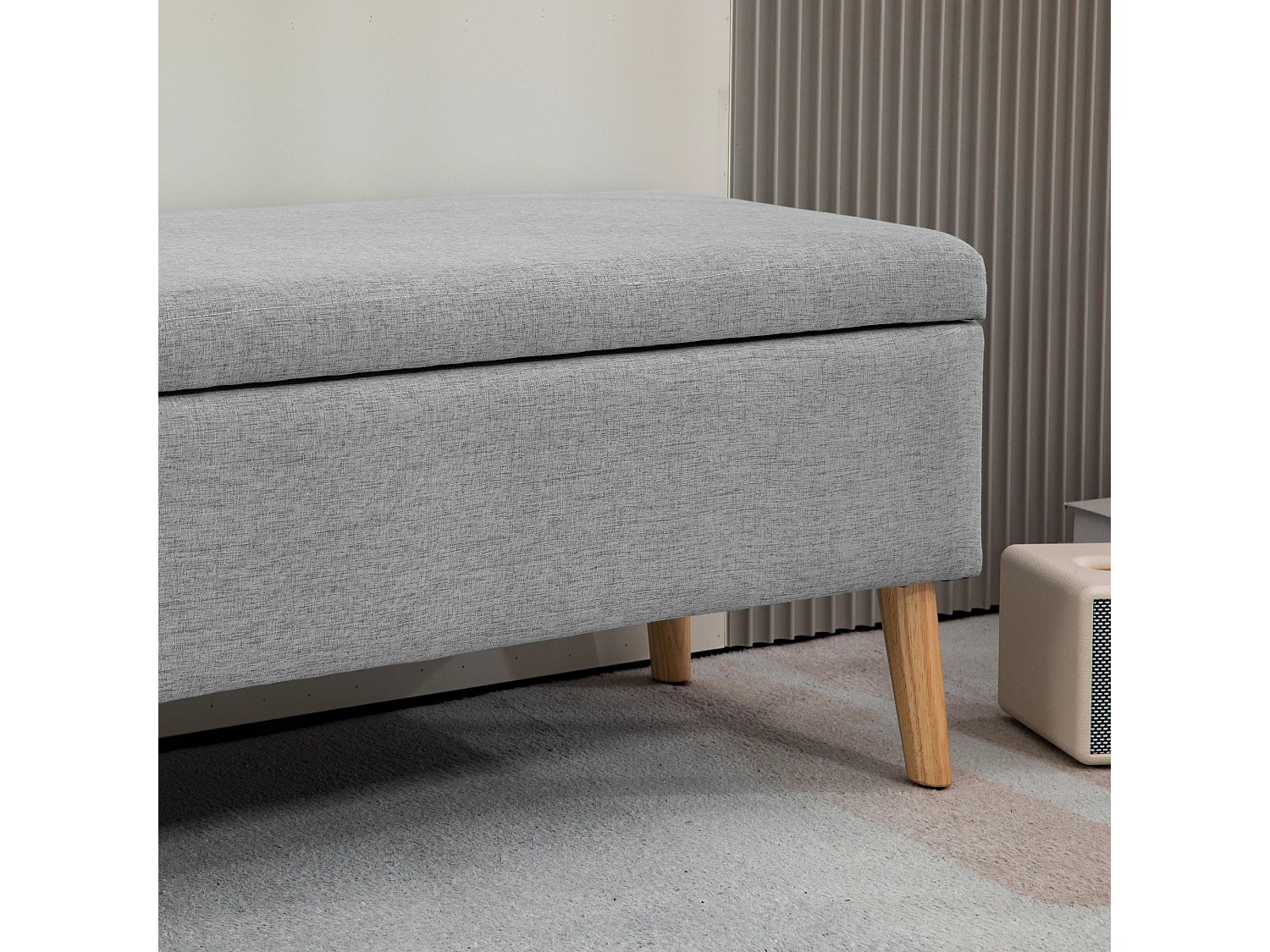 Banc de rangement rembourré, design scandinave, polyester gris avec effet lin, pieds en bois (110x39x45cm)