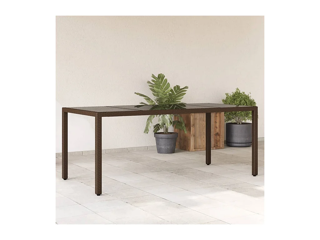 Table de jardin avec dessus en verre marron résine tressée