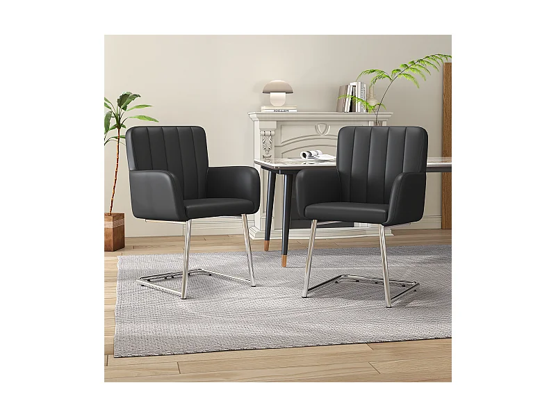 Juego de 2 sillas de comedor de piel sintética negra con respaldo y reposabrazos y patas de metal plateadas.