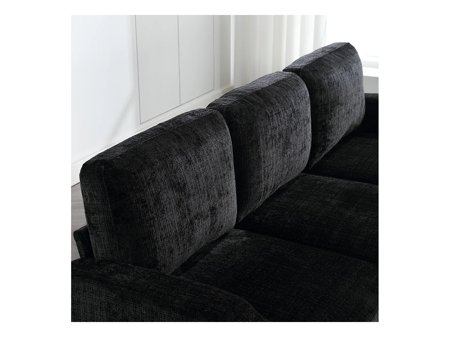 Divano modulare a 4 posti in ciniglia nera con pouf contenitore, portabicchieri e tasche laterali - per soggiorno