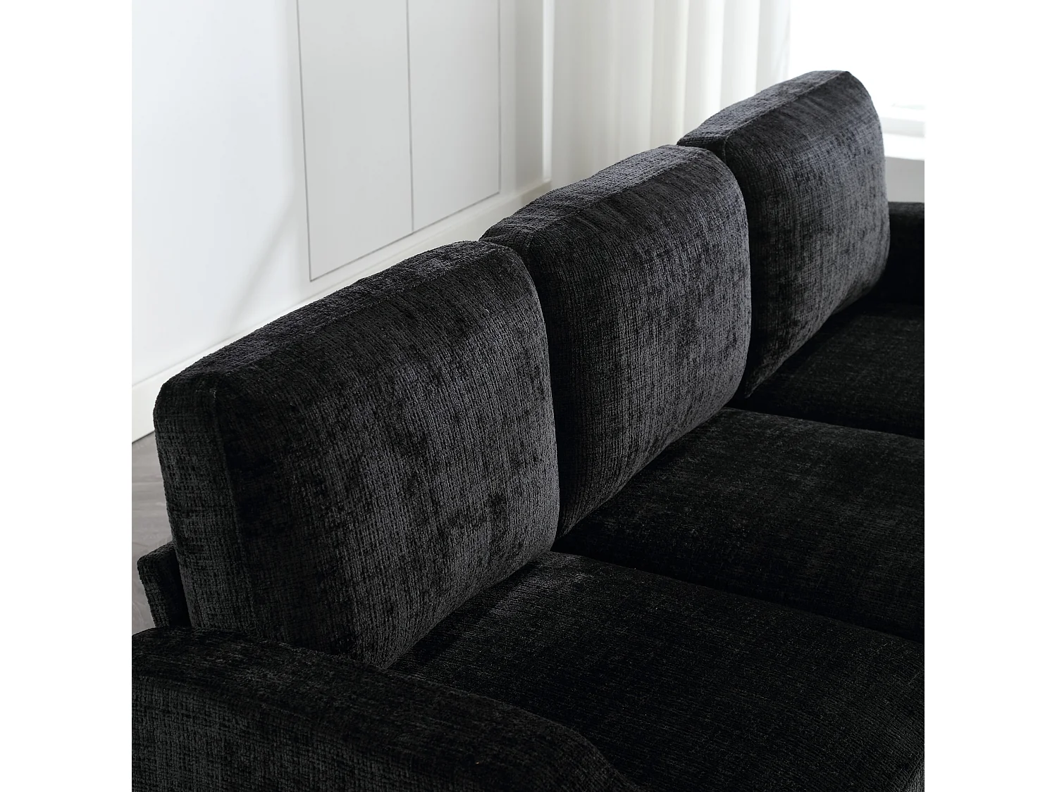 Divano modulare a 4 posti in ciniglia nera con pouf contenitore, portabicchieri e tasche laterali - per soggiorno