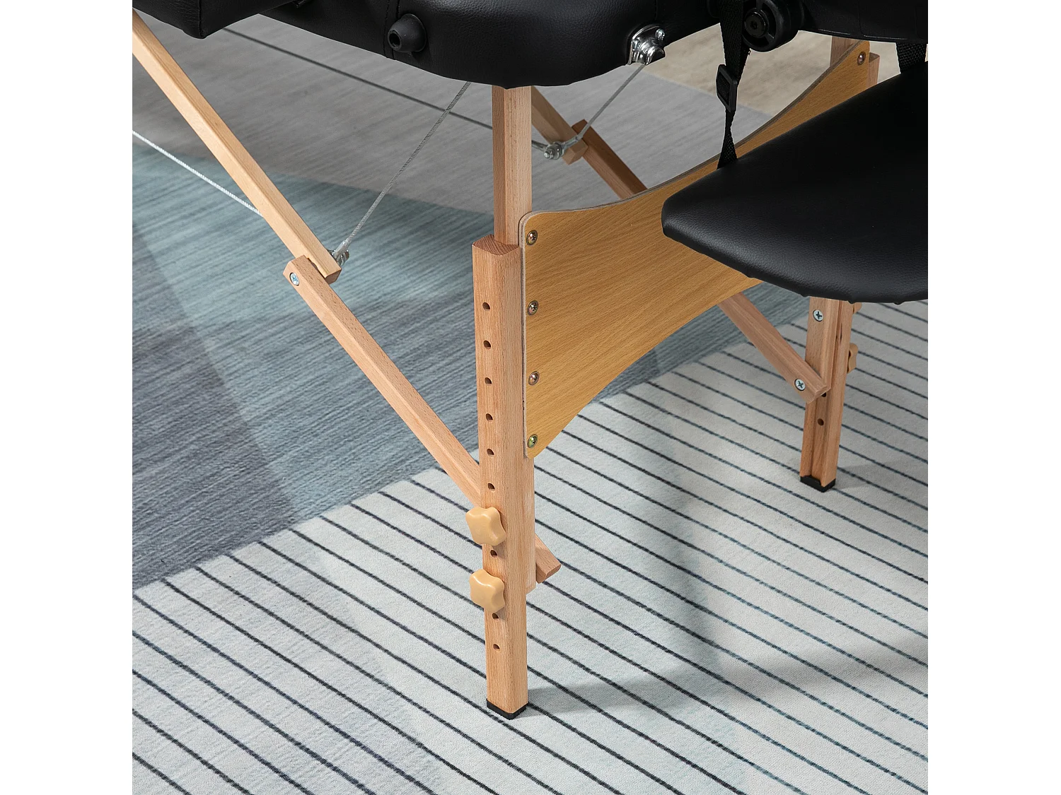 Lettino per massaggio pieghevole con altezza regolabile nero