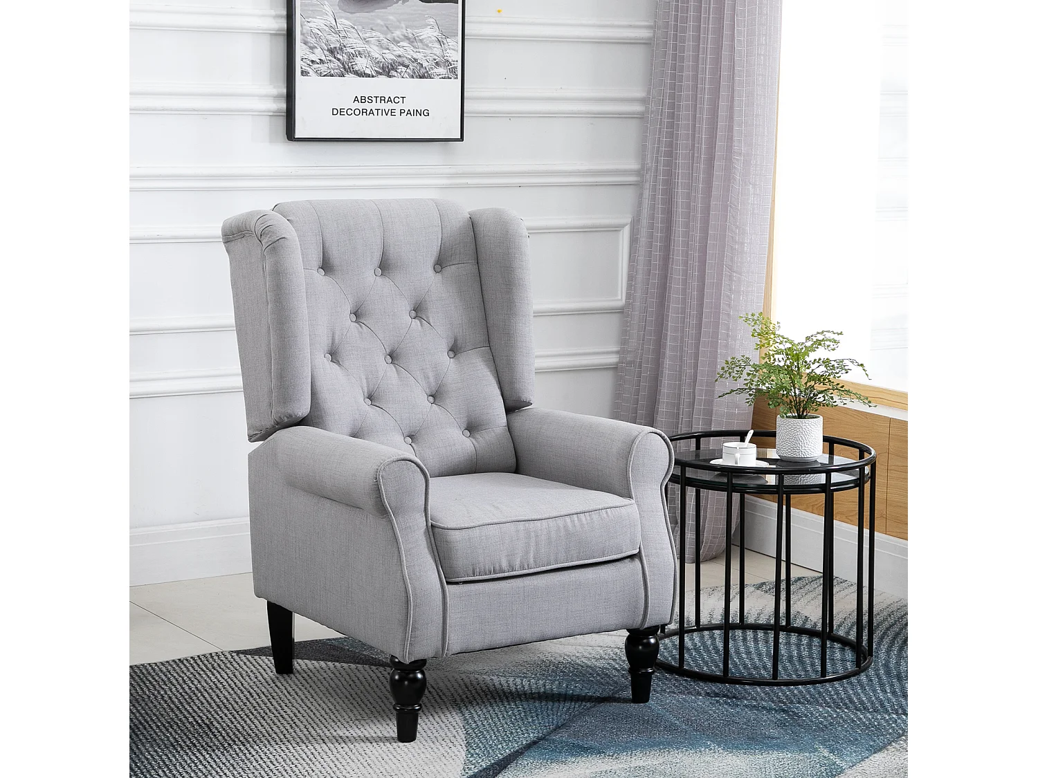 Poltrona grigia con ampia seduta e cuscini sfoderabili grigio