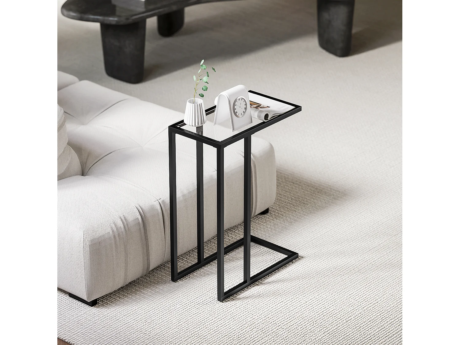 Tavolino da caffè a forma di c in vetro e acciaio nero