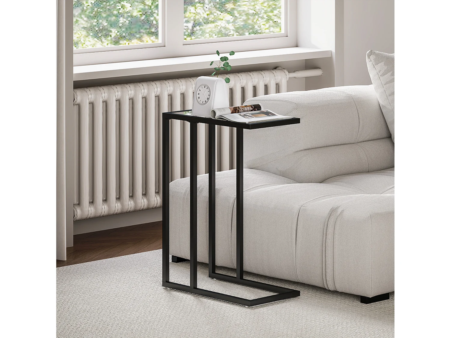 Tavolino da caffè a forma di c in vetro e acciaio nero