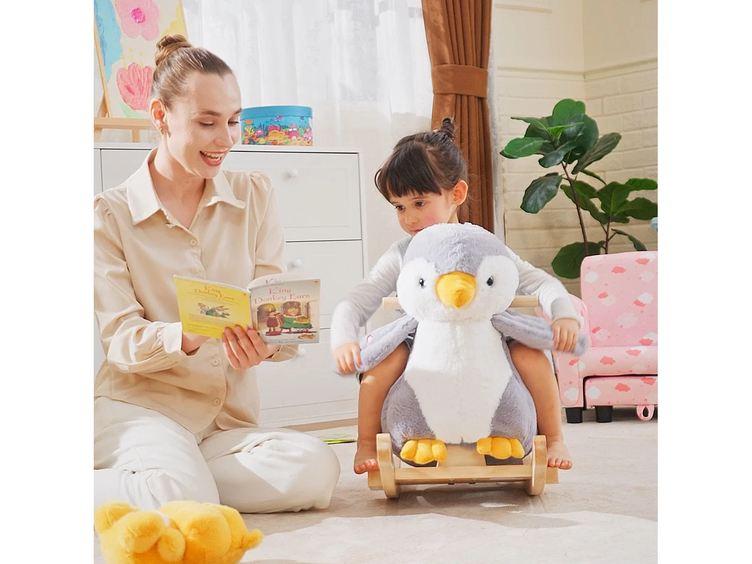 Cavallo a dondolo pinguino in peluche con musiche e cintura