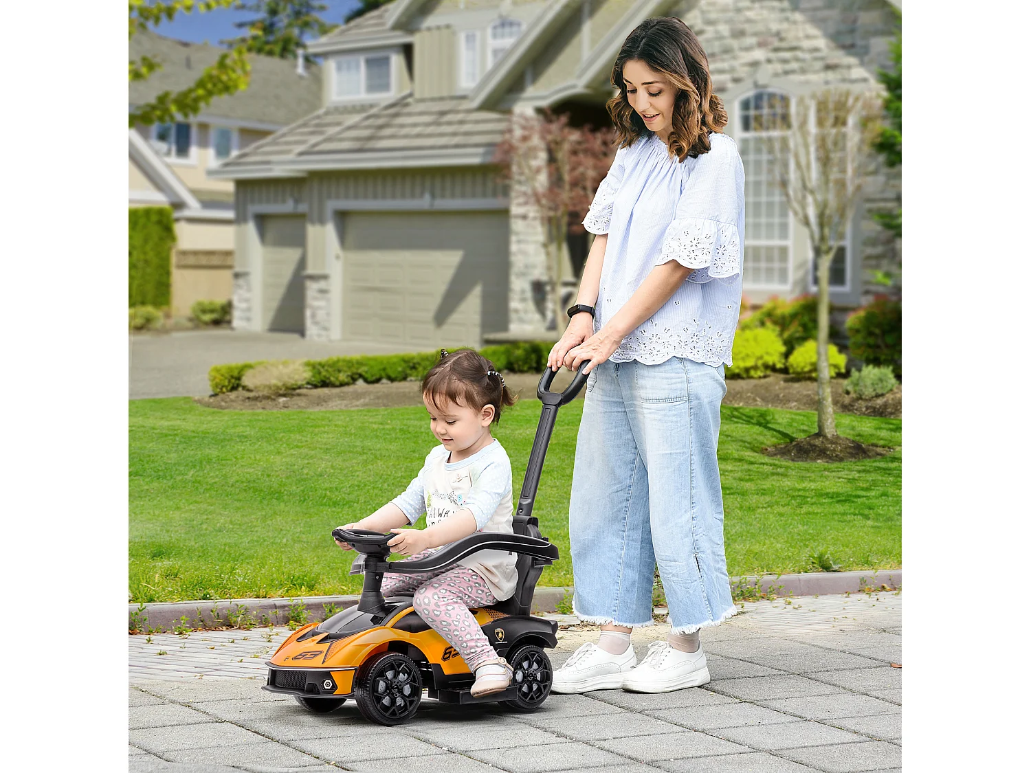 Macchina per bambini con maniglione e barriera di sicurezza arancione