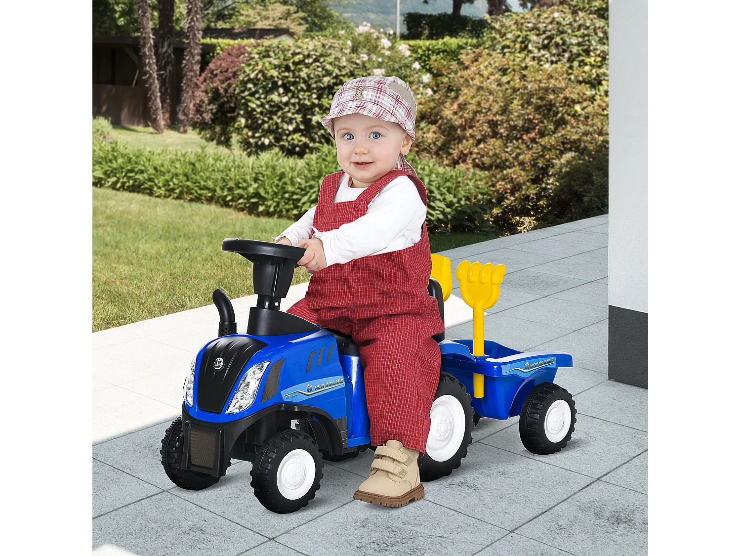 Trattore cavalcabile per bambini con rimorchio rastrello e pala