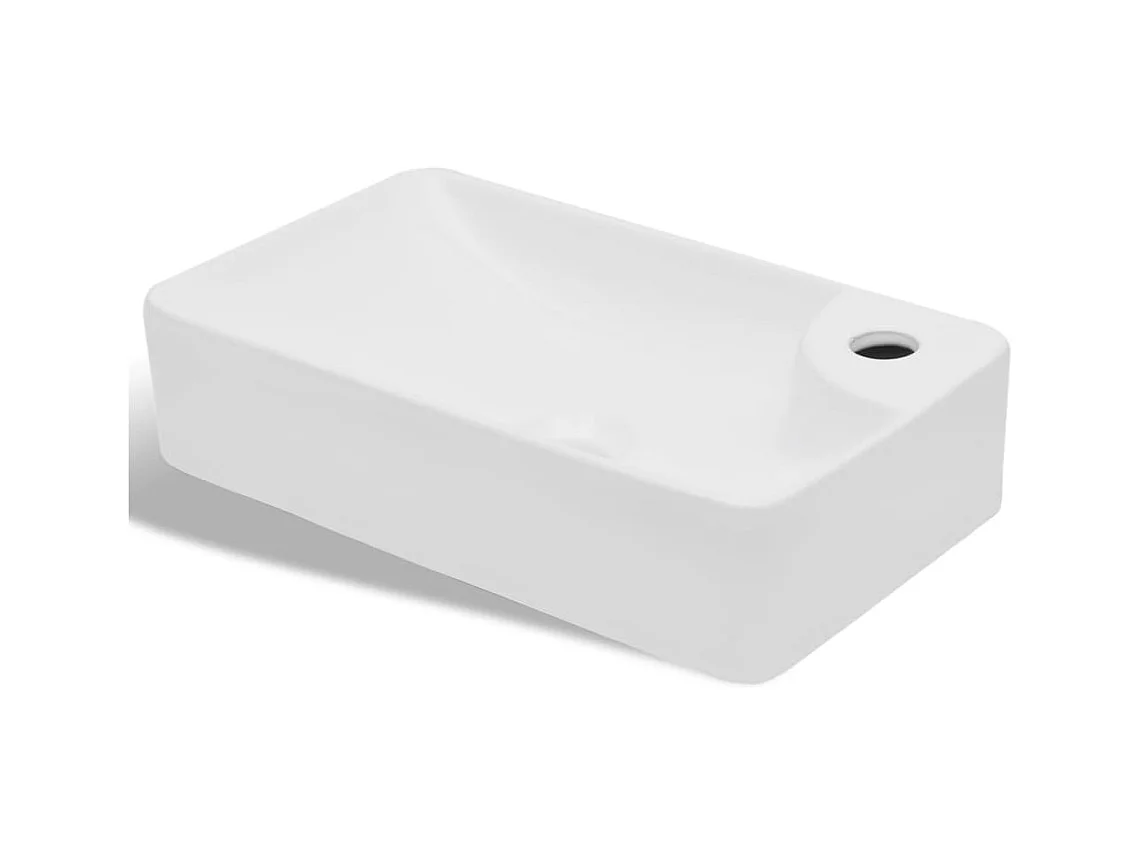 Witte keramische wastafel met kraangat