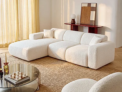 Grand canapé d'angle gauche convertible en tissu bouclette blanc POGNI de Maison Céphy