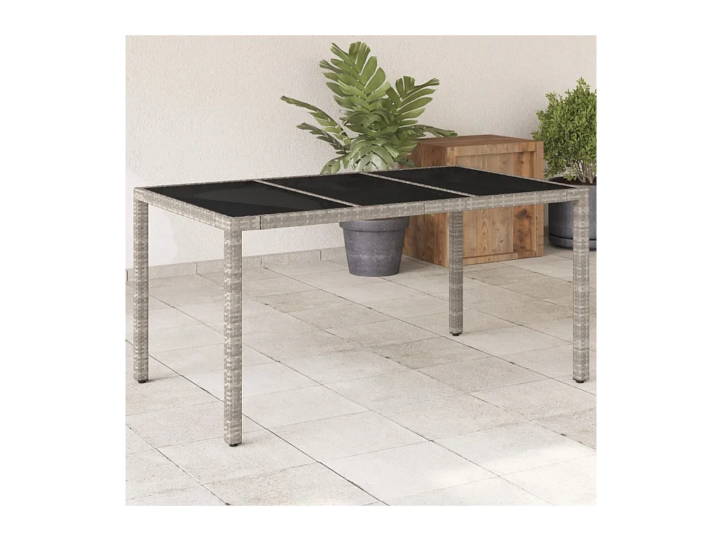 Tuintafel met lichtgrijs glazen blad en gevlochten hars