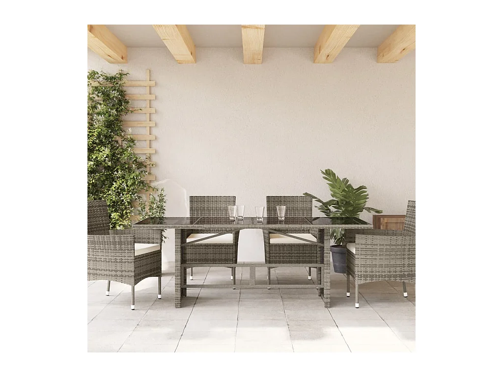 Tuintafel met grijs glazen blad en gevlochten hars