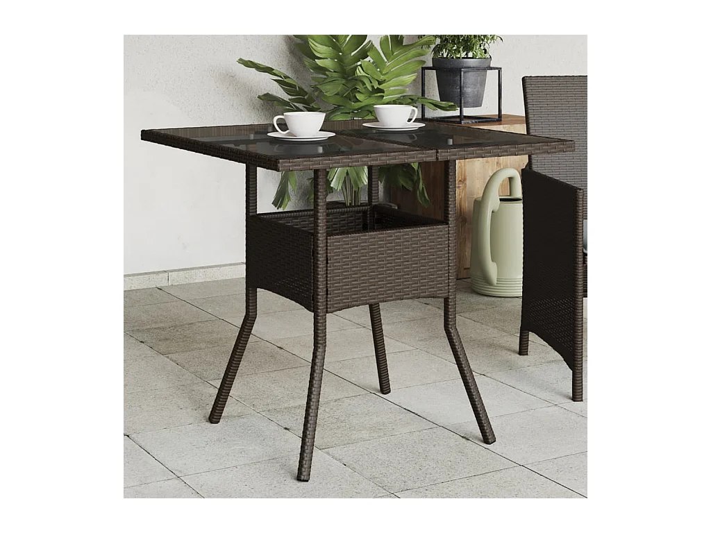 Tuintafel met bruin glazen blad en gevlochten hars