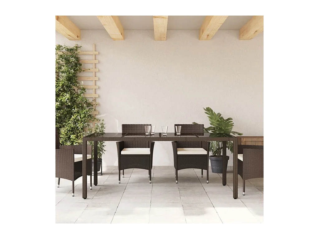 Tuintafel met bruin glazen blad en gevlochten hars