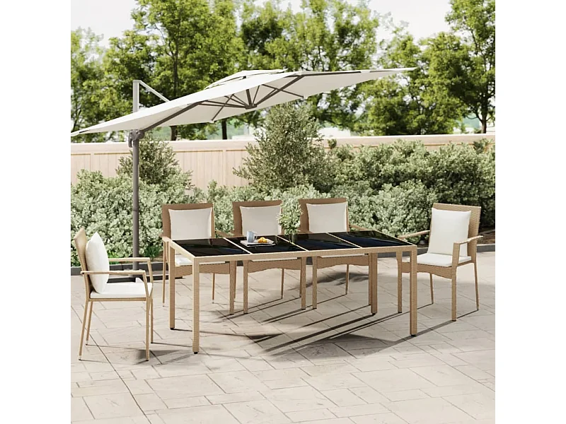 Mesa de jardín con tapa de cristal, resina tejida y cristal templado.