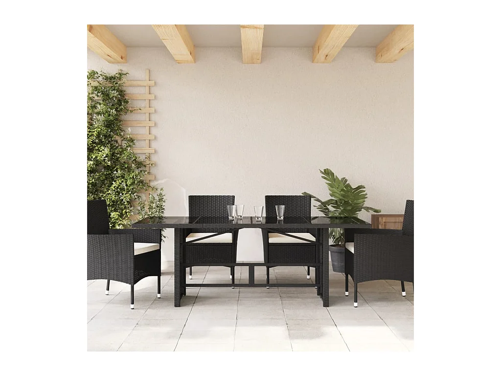 Tuintafel met zwart glazen blad en gevlochten hars