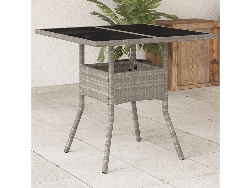Tavolo da giardino con piano in vetro grigio chiaro e resina intrecciata